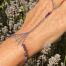Bracelet (bijoux de main composé d'un bracelet qui s'accroche également sur le majeur) sur le thème Halloween avec une breloque argent représentant une toile d'araignée, composé d'améthyste - vue de face